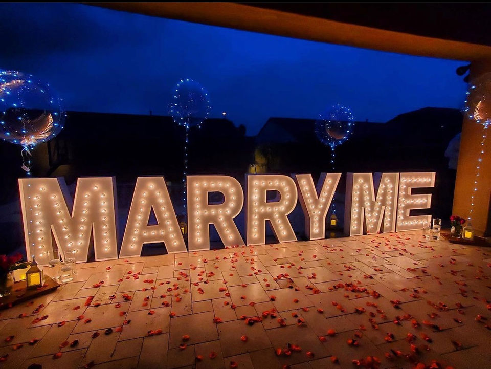 Lighted 3 ft tall Marquee letters in a high quality steel powder coated white finish spelling MARRY ME by Sunshine Glow Co.