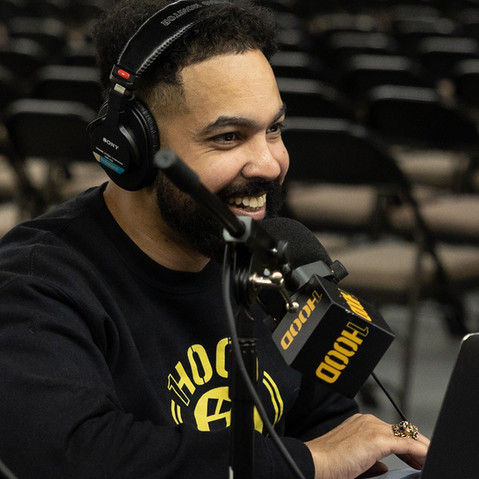 Man talking in front of 1Hood microphone