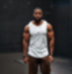 Caleb Beauplan, Founder and Creative Director of Aesthetics Dynasty, wearing AD performance tank