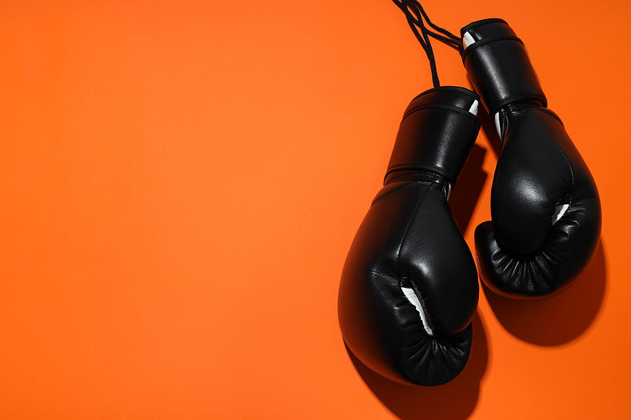 black-boxing-gloves-on-an-orange-background-2025-03-25-21-01-25-utc.jpg