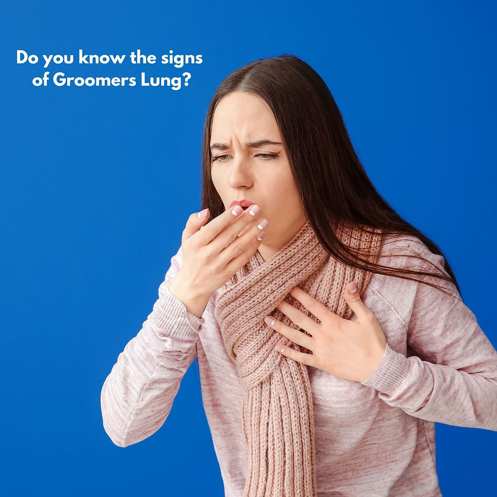 A woman holding her chest with her hand over her mouth coughing