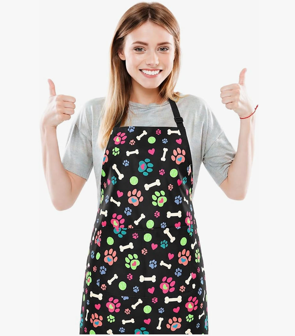 A dog groomer with her thumbs up for the Clipit waterproof dog apron