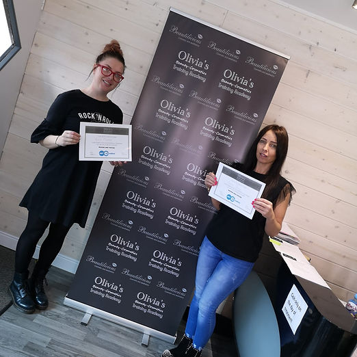 Two Students with Certifiates