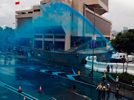 Hong Kong Police Spray Protesters with Blue Dye