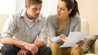 Couple discussing premarital budgets and money