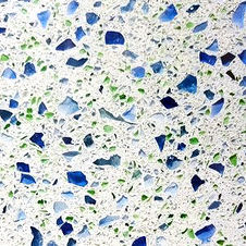 Blue & Green Glass speckles with a near white background quartz type of stone material called Icestone
