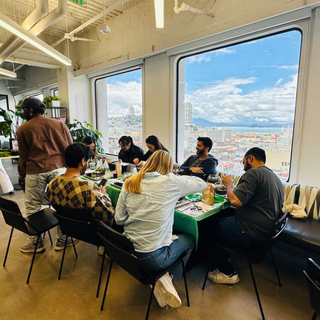 Participants creating terrariums during a corporate team-building workshop in San Francisco.