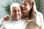 Close up headshot loving elderly father stroking overjoyed daughter head, family enjoying