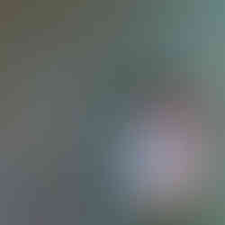 Couple smiling while standing in a creek