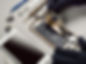 technician-repairing-broken-smartphone-desk.jpg