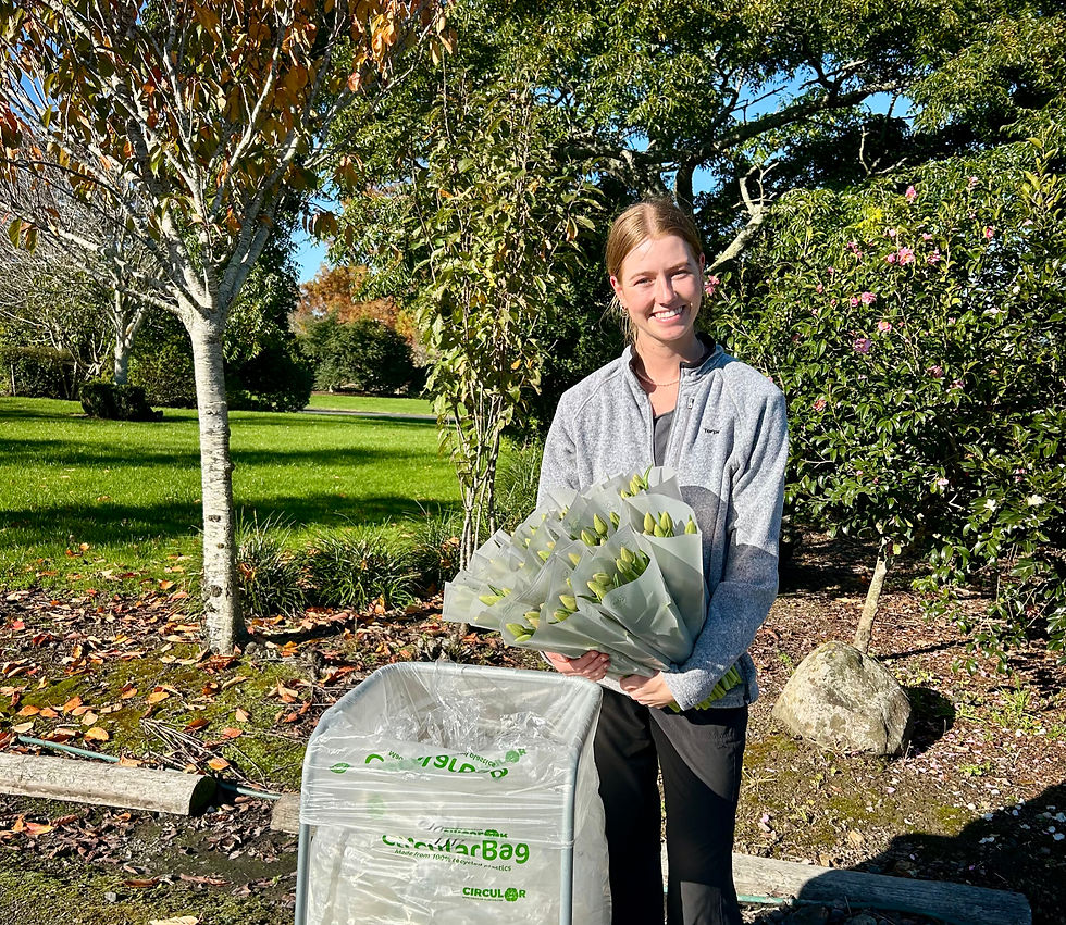 Wessels holding the 100% recycled flower sleeves. Photo: The Flower Loop