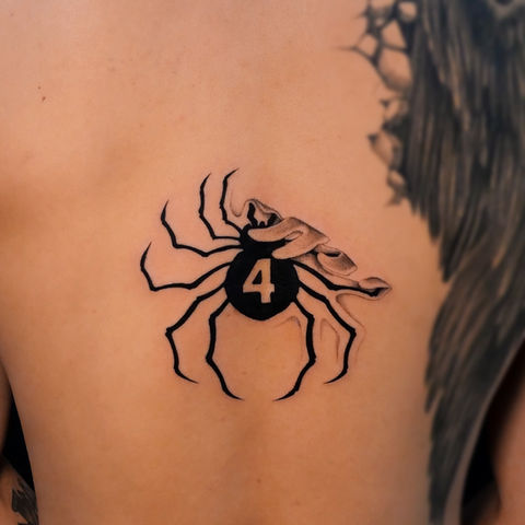 tattoo of hisokas phantom troupe spider being peeled off