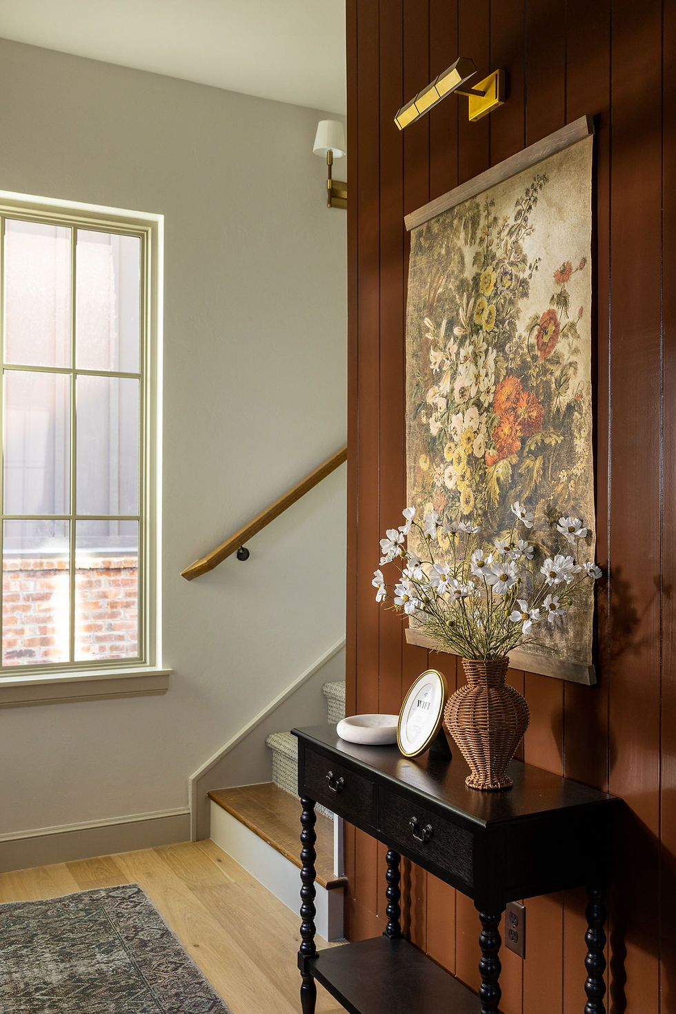 Entry design with chocolate brown accent wall