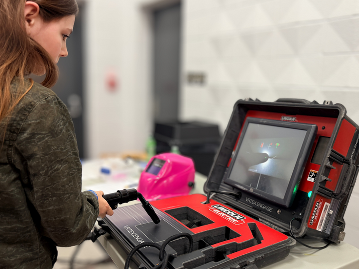 Trying out welding skills with a virtual welding simulator.