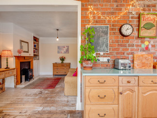 bare brick open plan kitchen living room