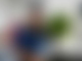 woman holding freshly washed head of lettuce grown at Moulton Farm