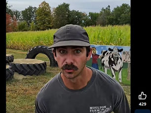 Man running in front of corn maze at Moulton Farm