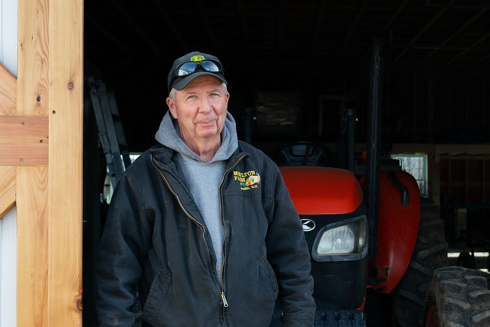 John Moulton standing in the door of our new barn at Moulton Farm