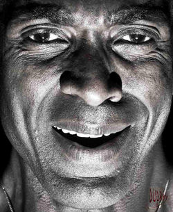 Homme malheureux - Photographie en clair-obscur par Dominique Dupray. Visage d'un homme sur fond noi