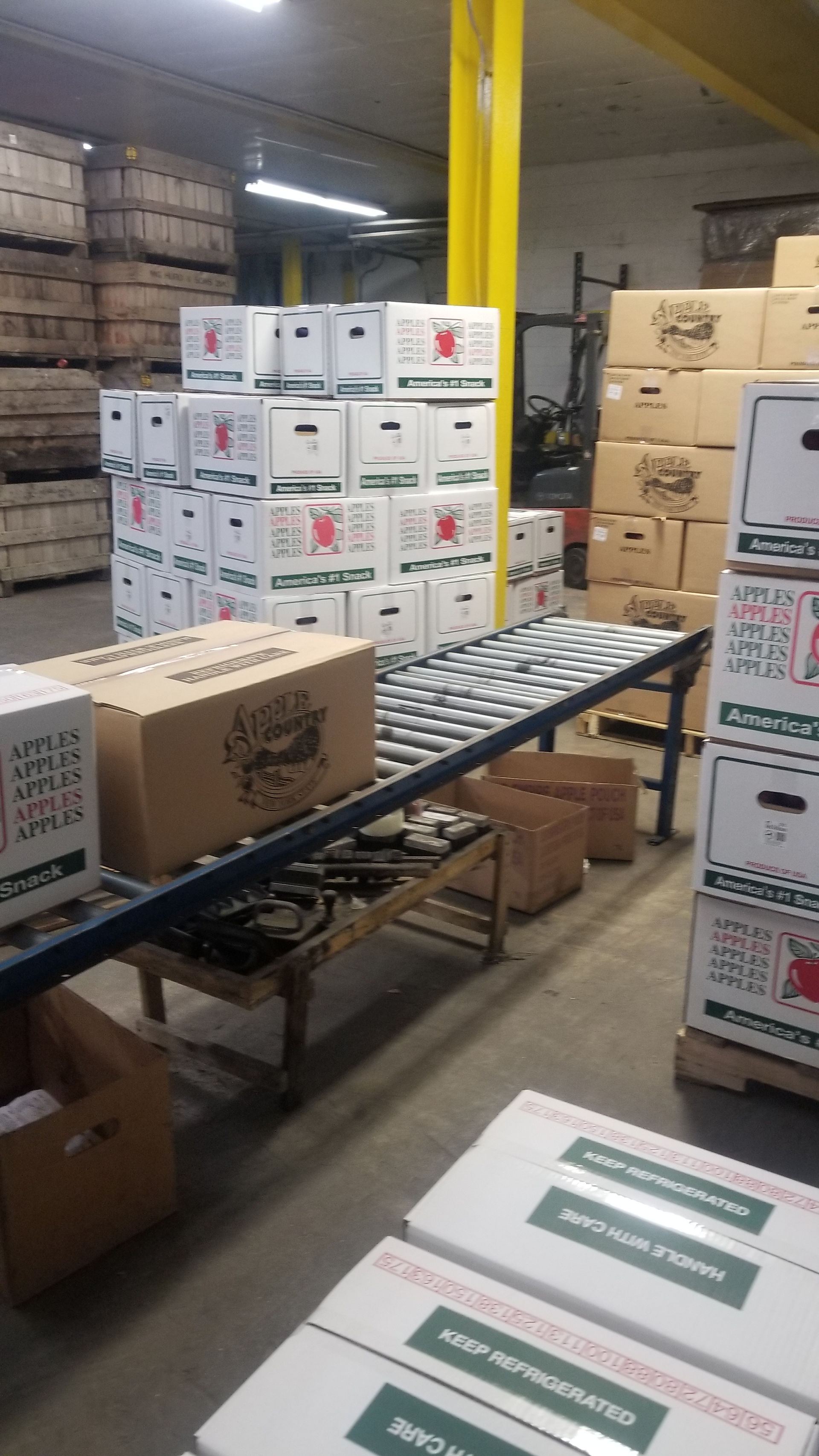 ny apples stacked on pallets by variety and grade to be shipped to grocery stores 2