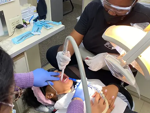 Saliva removal tool in a patient's mouth
