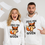 Thumbnail: Couple in white fox hoodies at home, woman tossing papers, man pointing at design