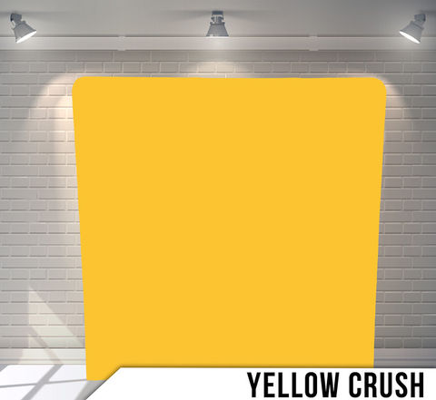 Yellow Crush backdrop with text in a white room, The Backdrops.