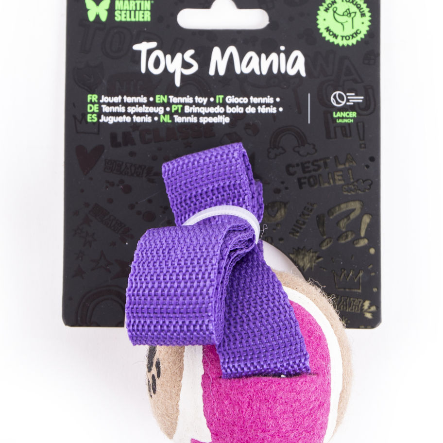 Toys Mania tennis ball toy with purple strap and logo details. Flonimaux