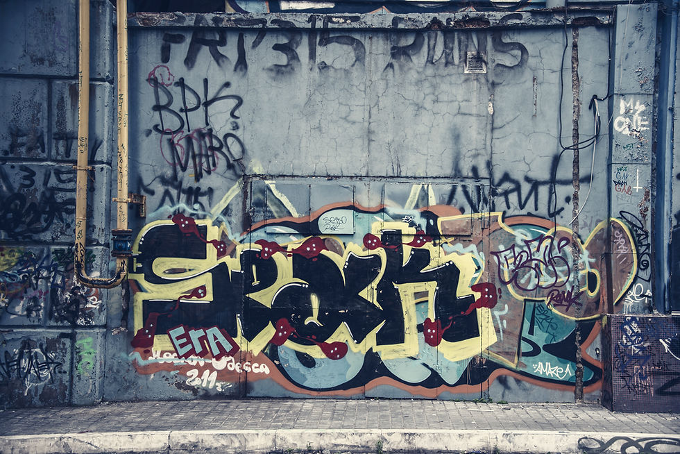 Colorful graffiti on a gray wall.