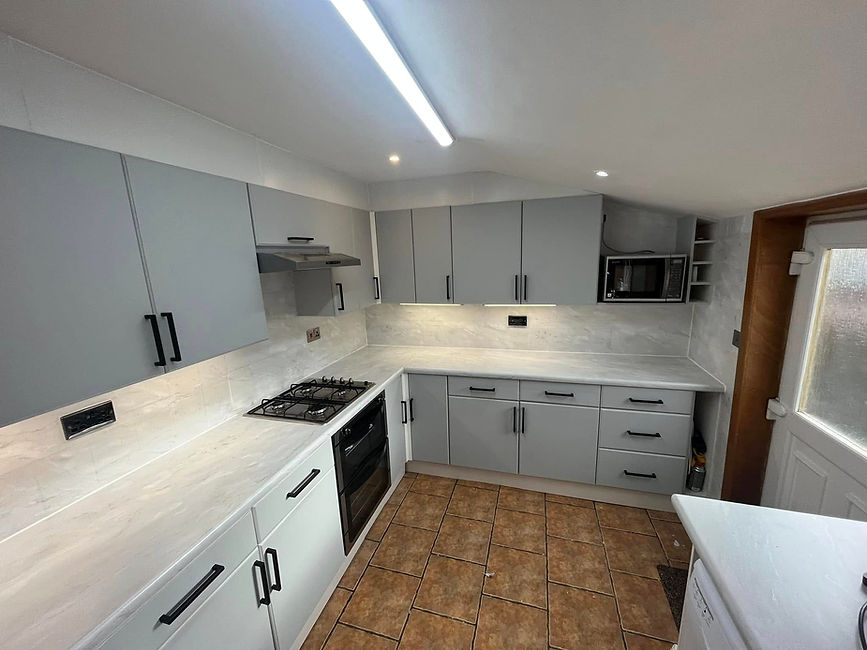 Contemporary kitchen in Dunfermline with sleek grey vinyl wrapped doors and integrated lighting