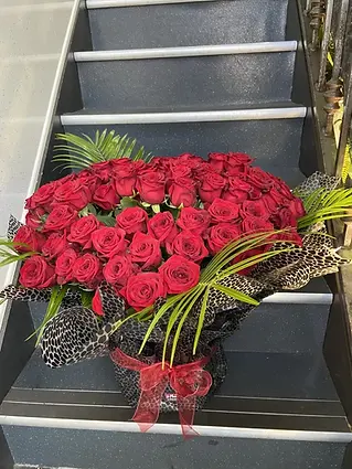 Large arrangement of deep red roses for event decoration