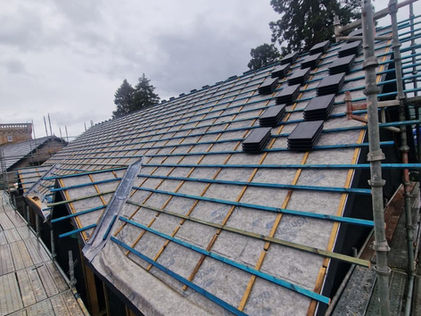 Old timber roof battens with breathable membrane ready for tiling works