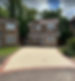 Smooth cream resin bound driveway with a neat darker block paved border edge