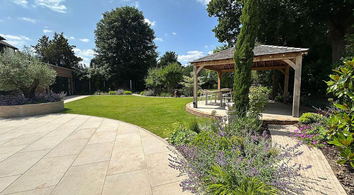 Complete garden makeover with a wooden gazebo and natural stone paving