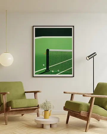 ramed green artwork hanging above two armchairs