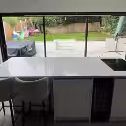 A kitchen with large windows
