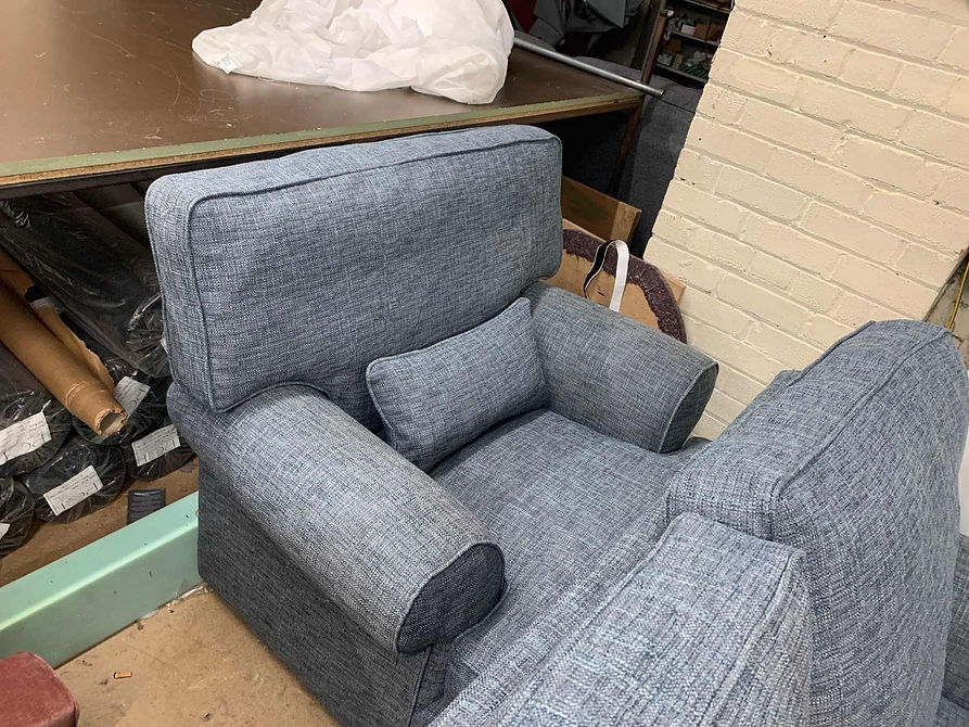 Grey high-back armchair reupholstered in textured fabric