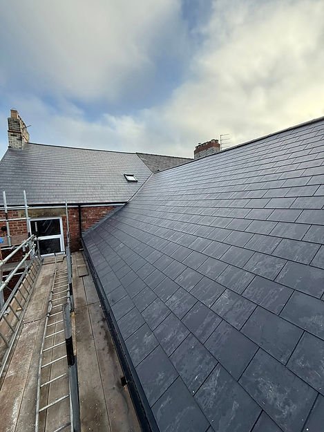 New black roof with scaffolding around