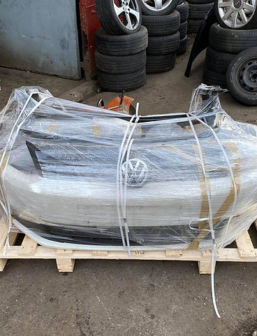 Wrapped front bumper on a wooden pallet ready for dispatch
