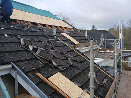 Old worn roof tiles on a house in Arrochar before stripping and replacement