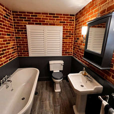 White wooden window shutters in a contemporary bathroom setting