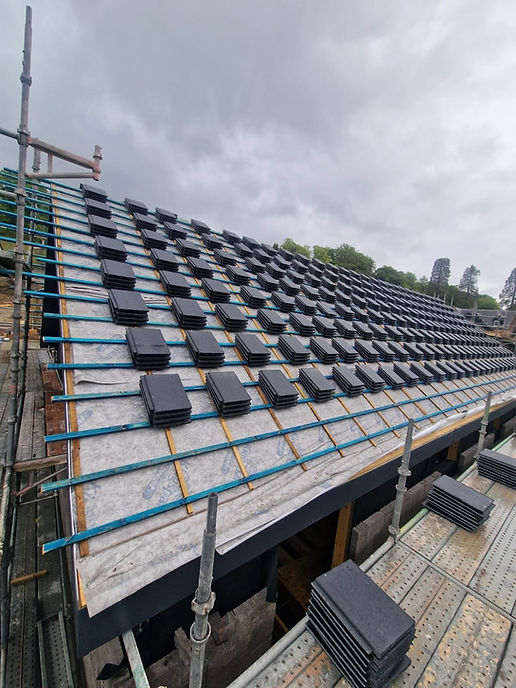 Large timber roof framework with battens ready for tiling