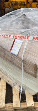 Securely packaged silver car bumper panel on pallet