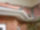 Close up of low maintenance white uPVC soffits under a tiled roof