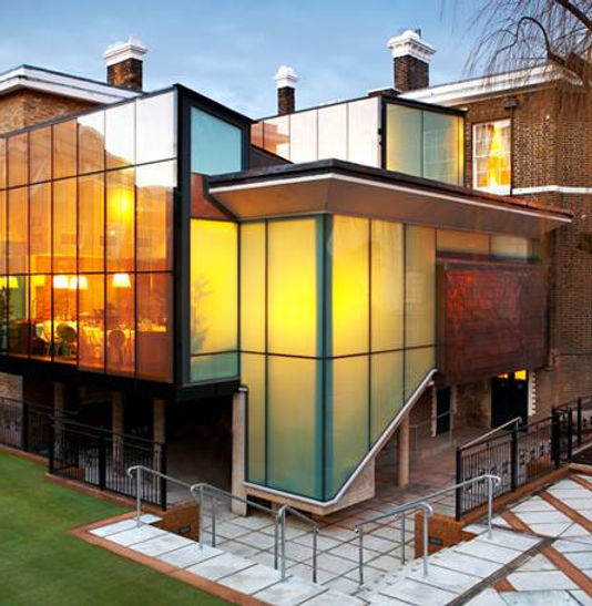 Multi-storey modern building exterior with structural glass facade and balconies