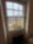 Black traditional radiator installed under a window in a nursery