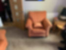 Reupholstered peach velvet armchair in a living room