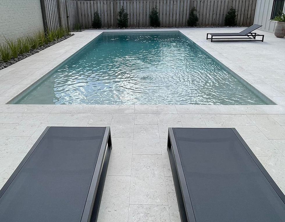 Eye-level view of a spacious backyard pool design