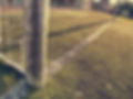 Hang bended white soccer net in soccer football net. Grass and white painted line on foot