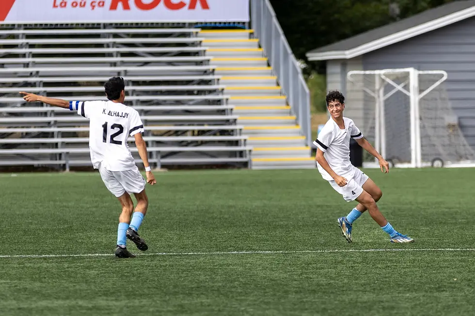 Mo Alhajjy, right, celebrates with brother Khaled Alhajjy after scoring against Yukon at the 2025 Canada Games. Ollie Williams/Team NT